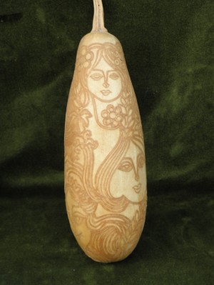 A female Lyrical One, carving